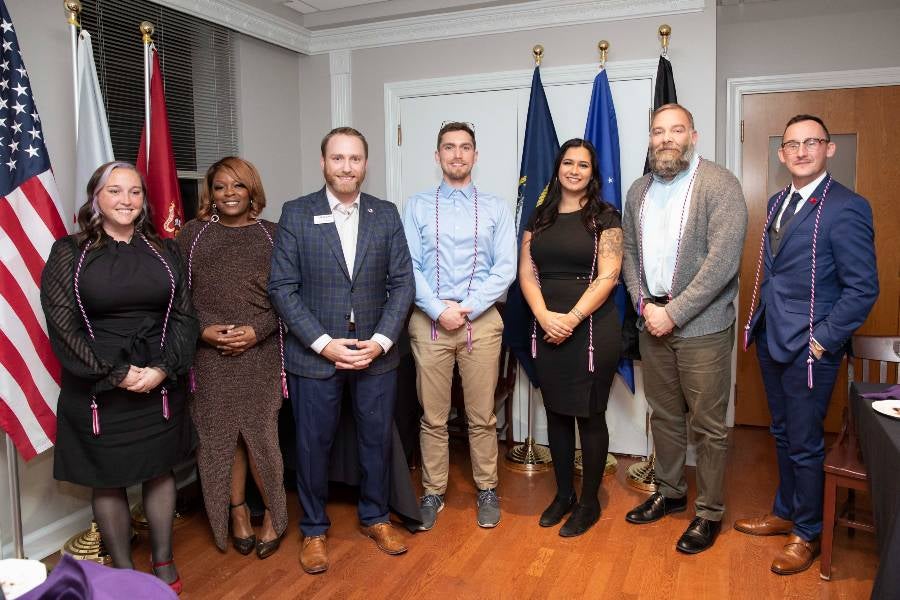 Student veterans receive their honor cords at a special dinner in their honor. 