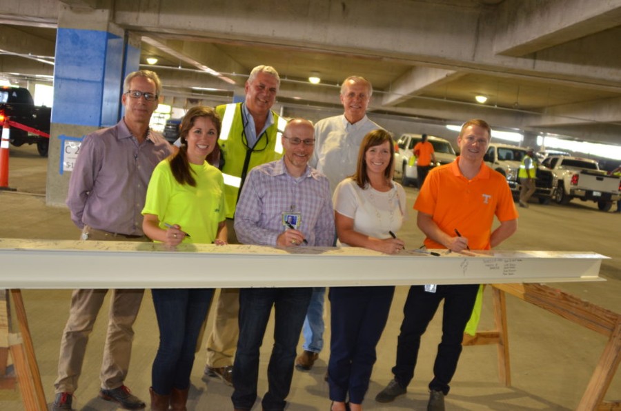 Holton with others on the airport team at a topping out ceremony