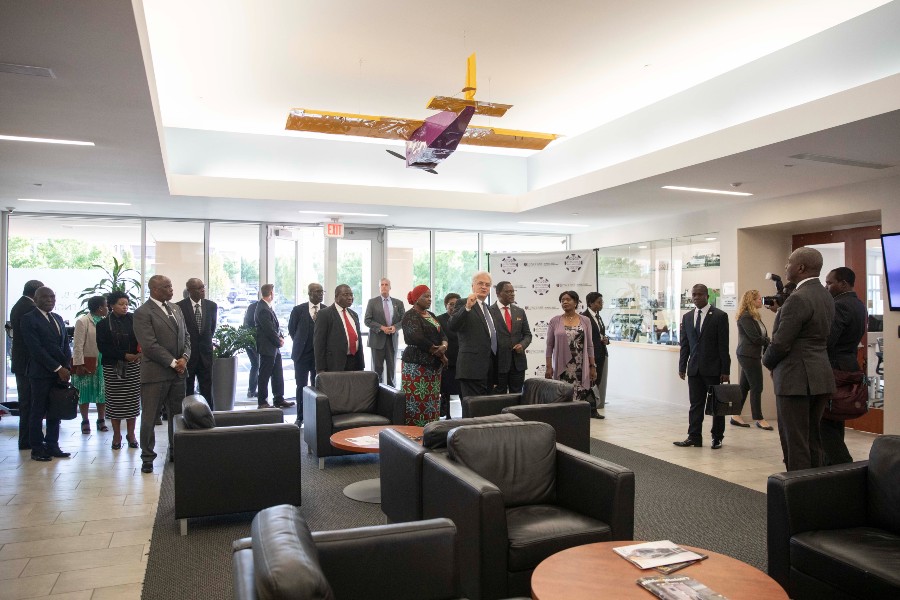Engineering dean give the President of Malawi a tour of the college facility