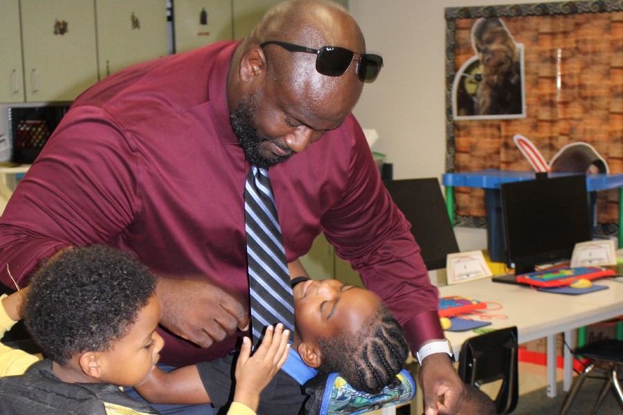 Dr. Toriano Green with students in the classroom