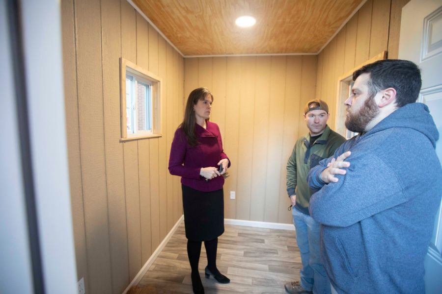 Lipscomb President Candice McQueen meets with students inside the microhome.