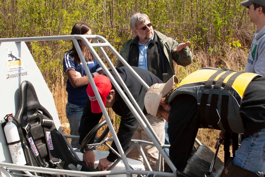 Fort Gwinn working with students at the Mini Baja ATV race competition