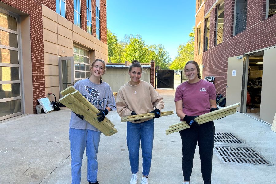 freshman students helping with construction