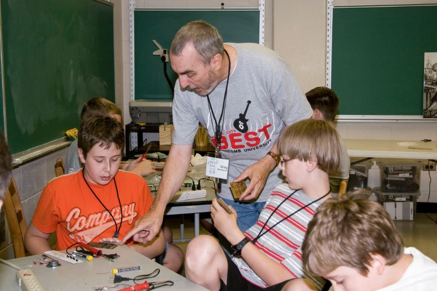 Greg Nordstrom helping students in the BEST Robotics outreach program