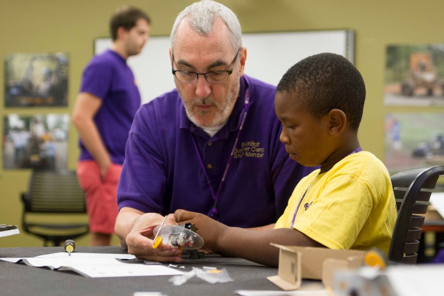 Greg Nordstrom helping youngsters at the Weebots summer robotics camp