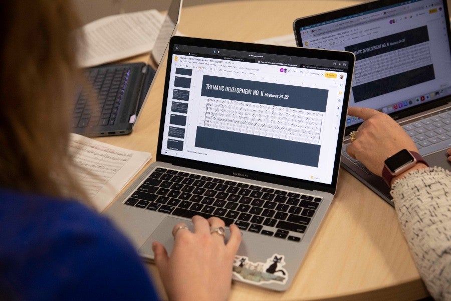 Students look at sheet music on their computer