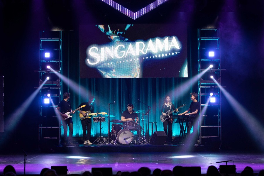 The 2023 Singarama Band performing on stage.