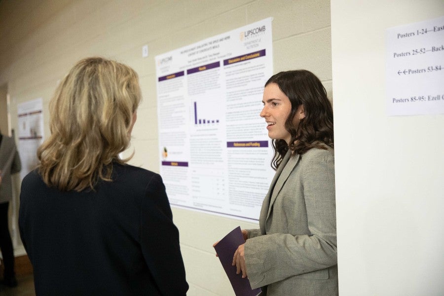 Tessa Vander Kamp presents her poster at the Student Scholars Synmposium