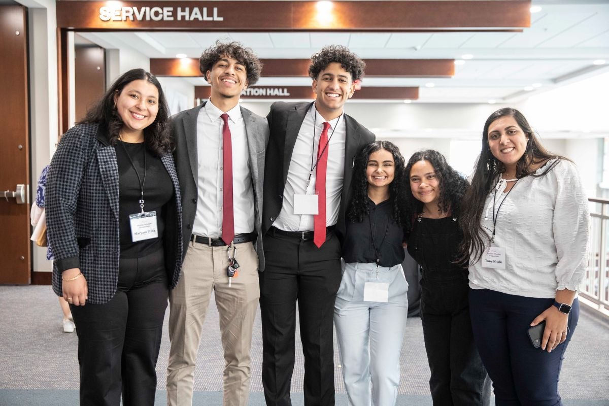 Students smiling at the Student Scholars Symposium