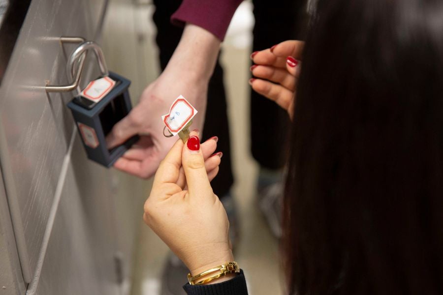 Students hold chemistry vial 