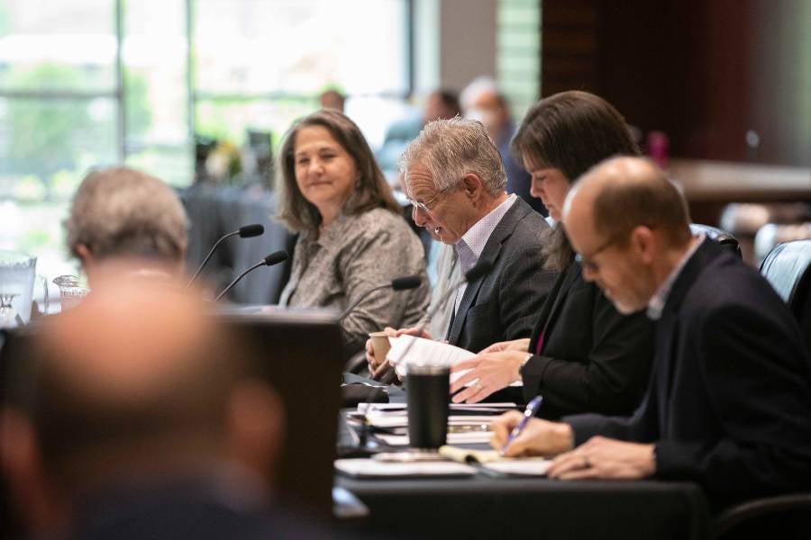 David Solomon presides over the April 2023 board meeting before the official passing of the gavel to a new chair.