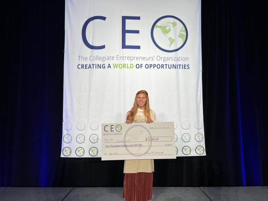Student posing after placing in CEO pitch competition
