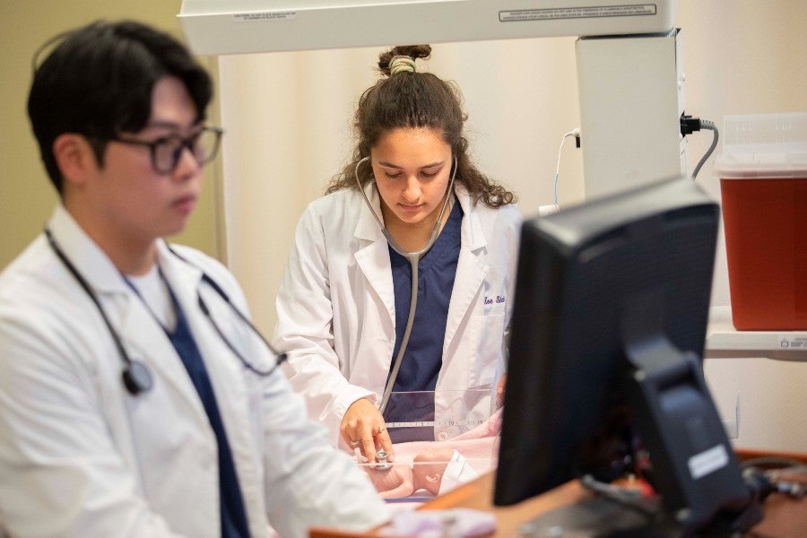 Nursing students in the patient simulation lab