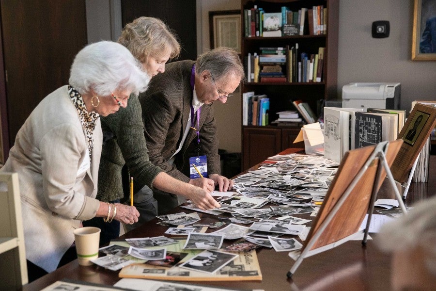 Former Backlog Editors look through archival photos
