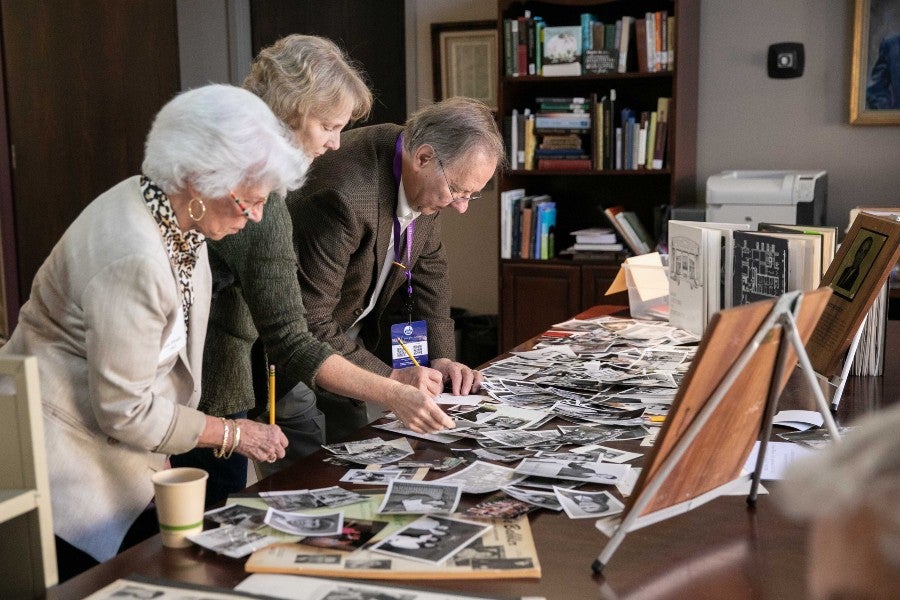 Former Backlog Editors look through archival photos