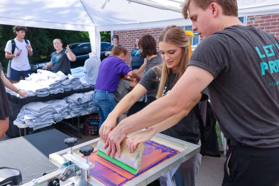 students working together to make an ink printed tshirt