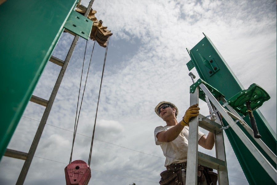 Alumnus Ethan Johnson works to install a bridge in Honduras in 2015