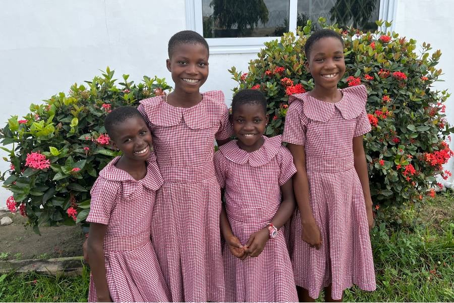 Four Haven girls in matching red dresses