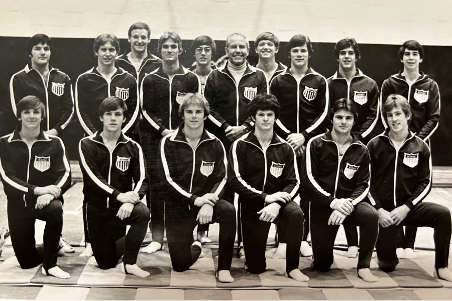 Members of the gymnastics team in years past with Coach Hanvey (center) 