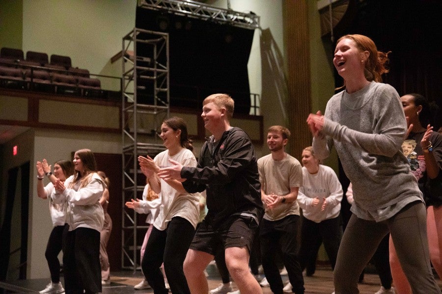 Today's students rehearse the 1970s themed show for Singarama 2024.