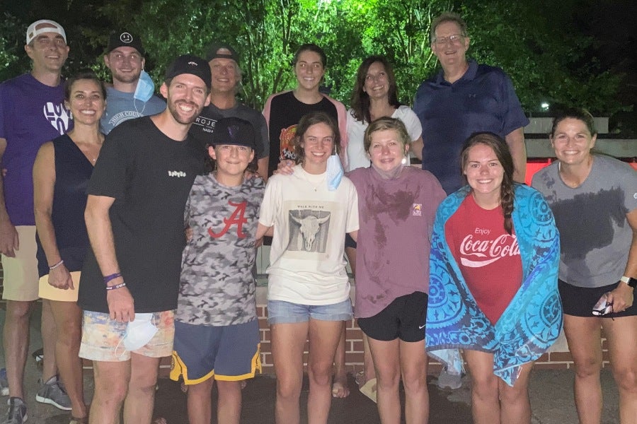 Sullivan's baptism in the Osman Fountain in Bison Square celebrated by Surrounded by 4:12 family and mentors