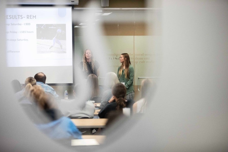 Students making a presentation at the symposium