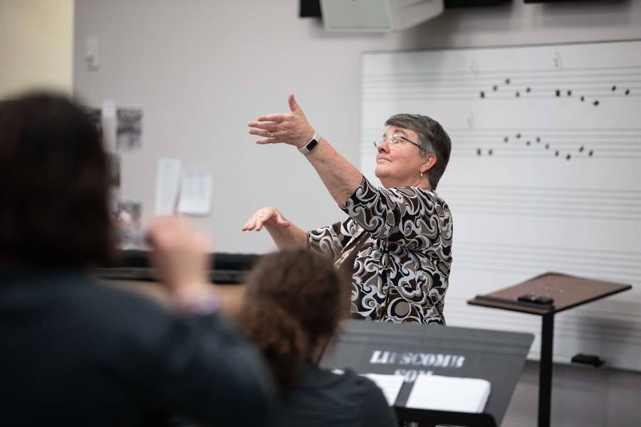 Ronda DePriest leading pep band rehearsal.