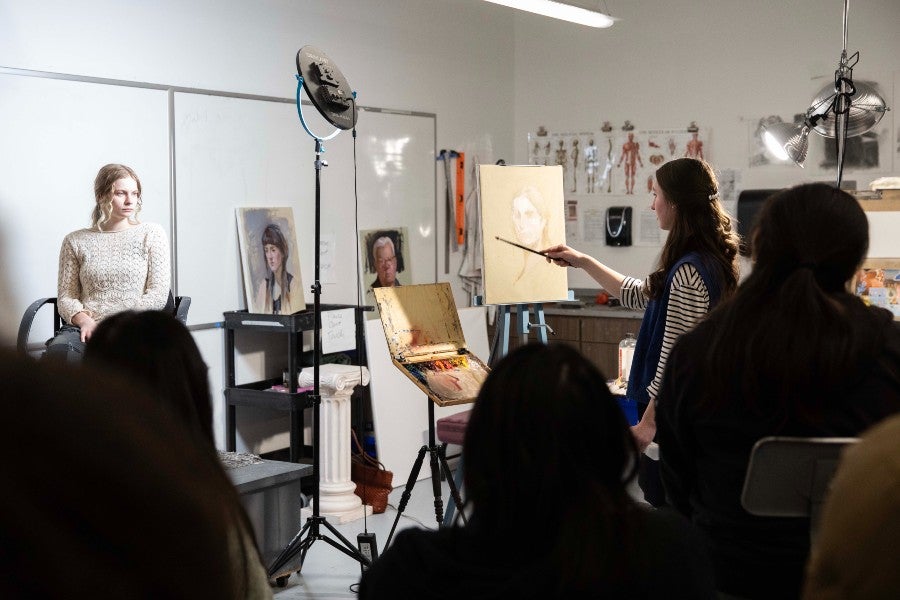 Visiting Artists teaching a workshop on portraiture
