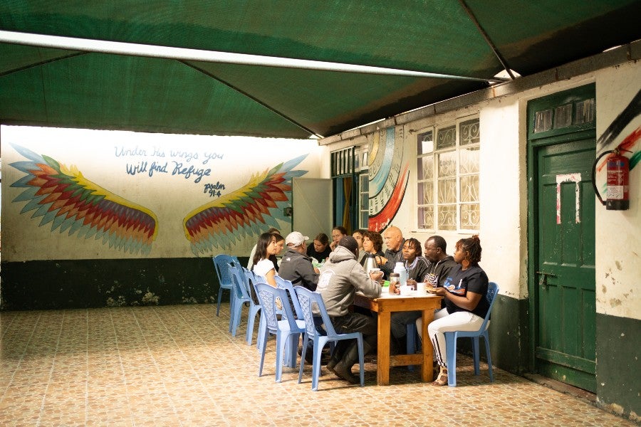 Water Surdacki eating lunch with Made in the Streets staff in Kenya