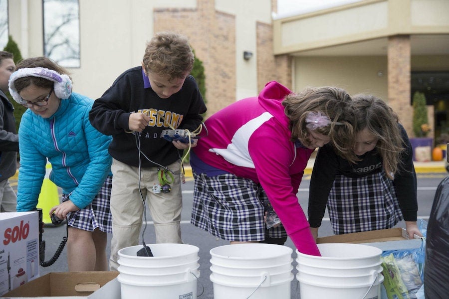 group of kids with buckets