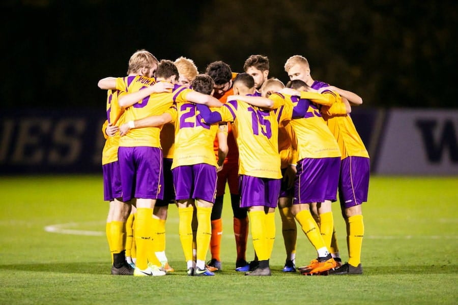 soccer team in a huddle