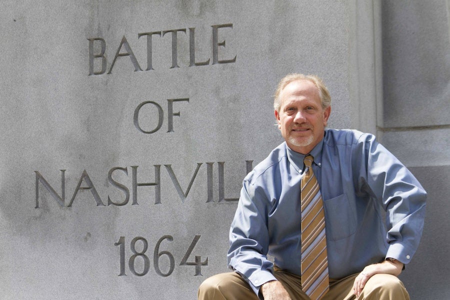 Tim Johnson in front of monument