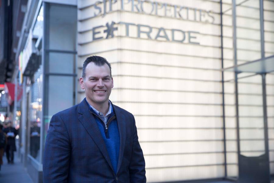 Chad Estep standing on the corner outside the ETRADE office in New York City. 