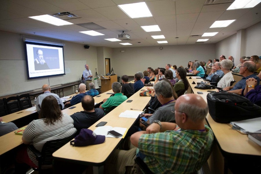 Summer Celebration attendees sitting in classroom lecture