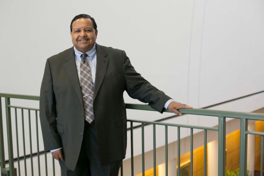 William Turner standing along rail in the Ezell Center