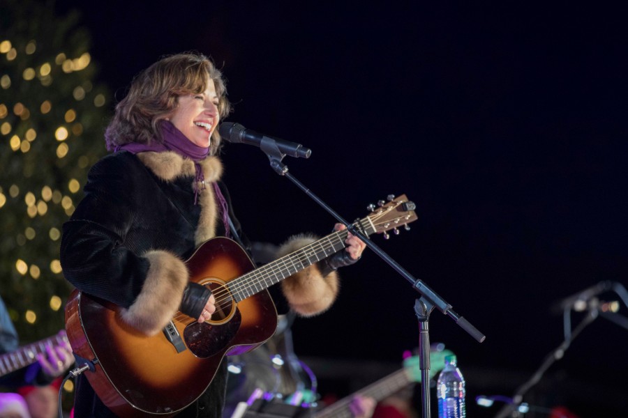 Singer Amy Grant holding a guitar