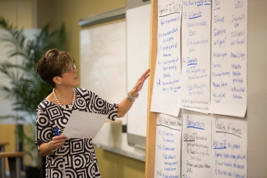 Tracy Allen writing on a white board