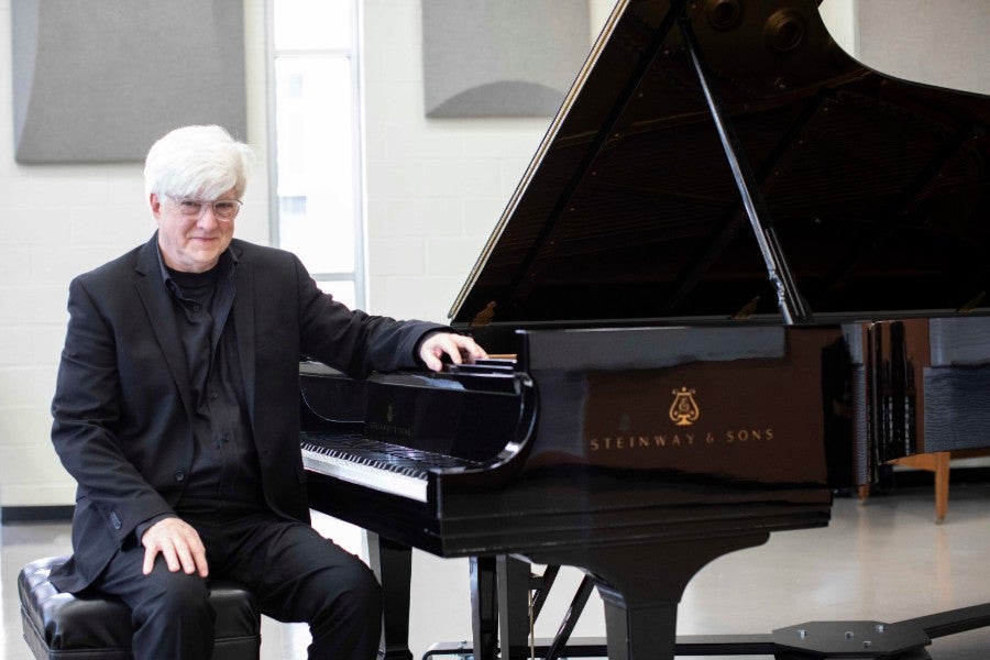 Jerome Reed at a Steinway piano.