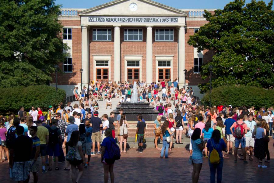 Students in Bison Square by fountain.