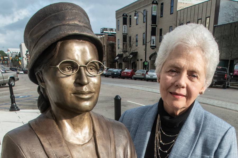 Artist Clydetta Fulmer with her statue of Rosa Parks.