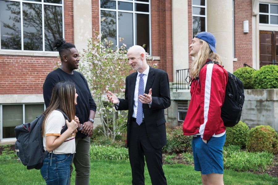 Student Life Dean Al Sturgeon speaks with student on the Lipscomb campus