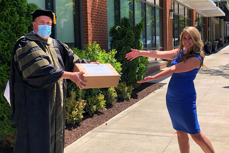 College of Pharmacy delivers gifts to a graduate in person