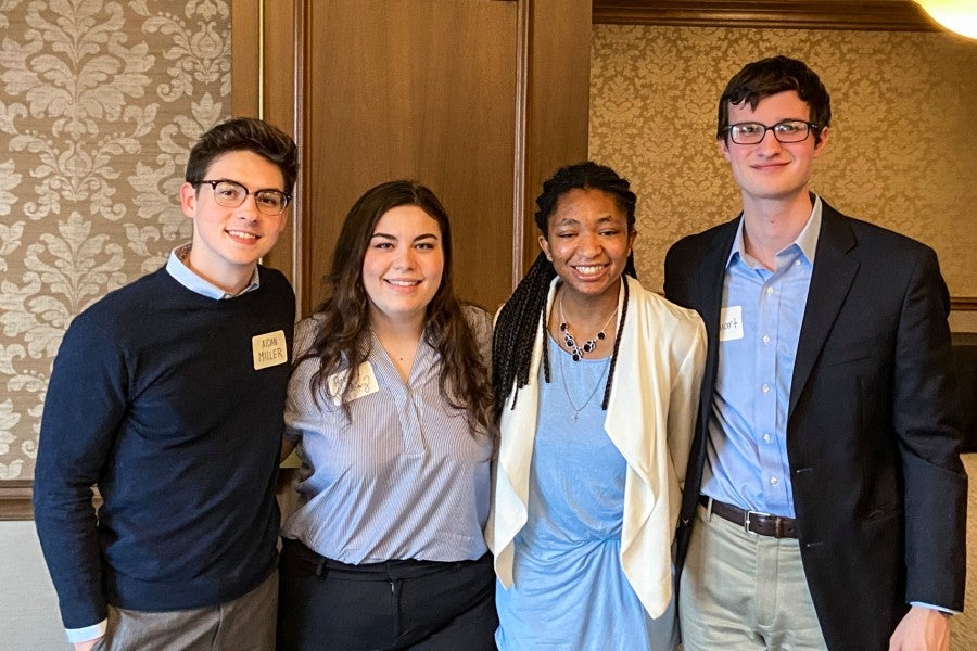 The four students on the winning pitch team