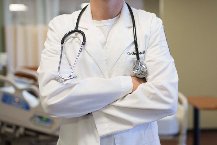 Health care worker with arms crossed