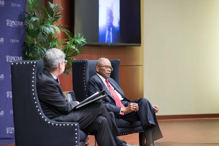 Randy Spivey, Fred Gray seated and talking.