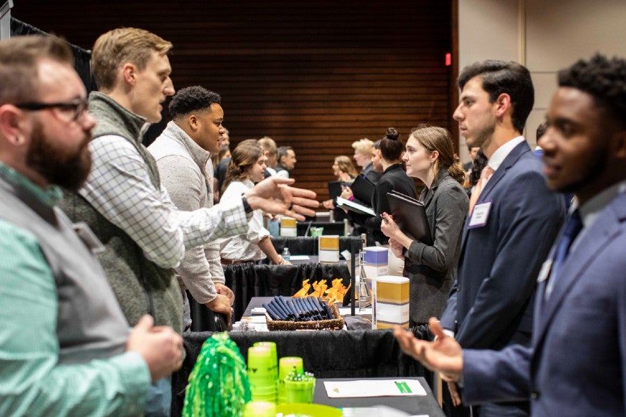 Students networking with employers