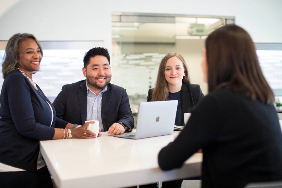 Students an recruiters at a meeting