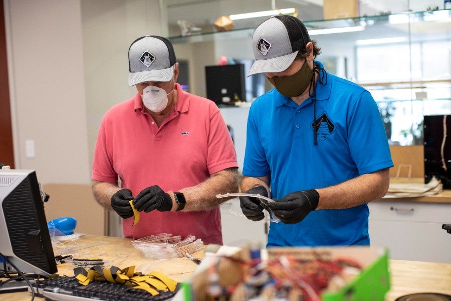 Peugeot staff working to create face shields