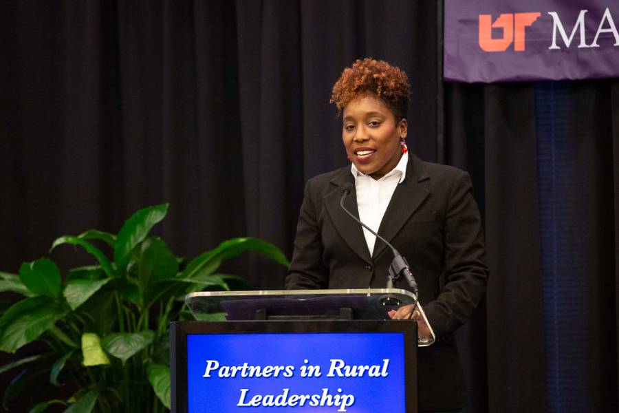 Michelle Steele speaking behind a podium