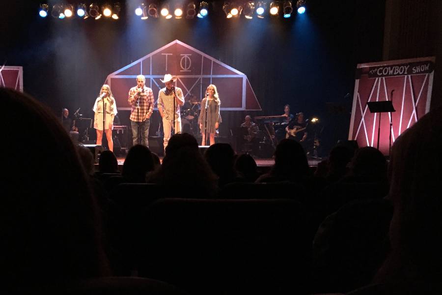 Students on stage for 2019 Tau Phi Cowboy Show